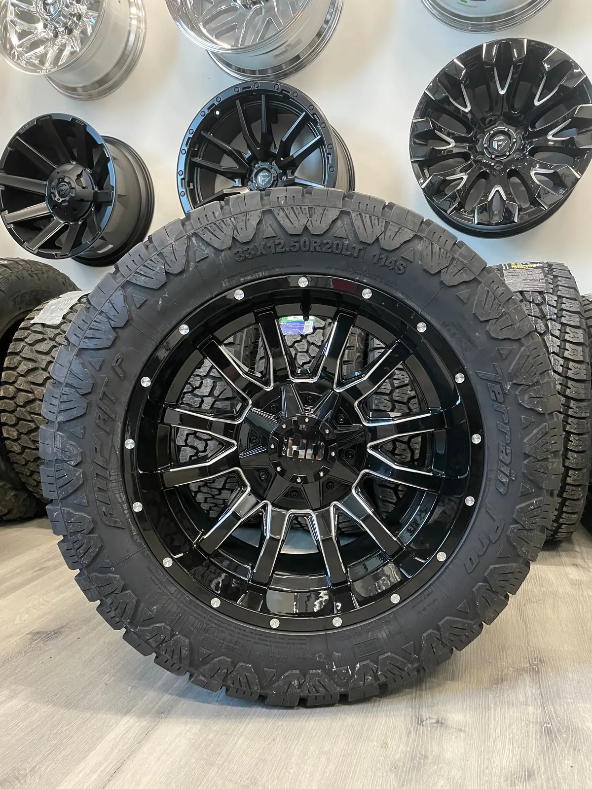 (Set Of Four) Fast Traxx 20X10 5X127/5X139.7 -15 Blk Milled | Lt33x12.50R20 10 Ply Amp Terrain Pro At ( Ram 1500/Jeep ) 1
