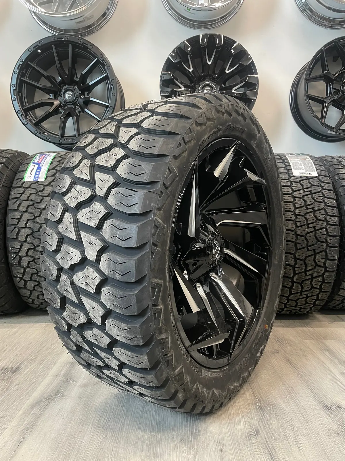 (Set Of Four) Fuel Reaction 22X10 5X139.7/5X150 -18 Gloss Blk Milled | Lt33x12.50R22 Amp Attack At 2