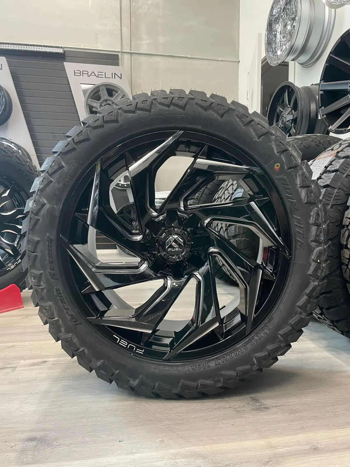 (Set Of Four) Fuel Reaction 22X10 5X139.7/5X150 -18 Gloss Blk Milled | Lt33x12.50R22 Amp Attack At 1