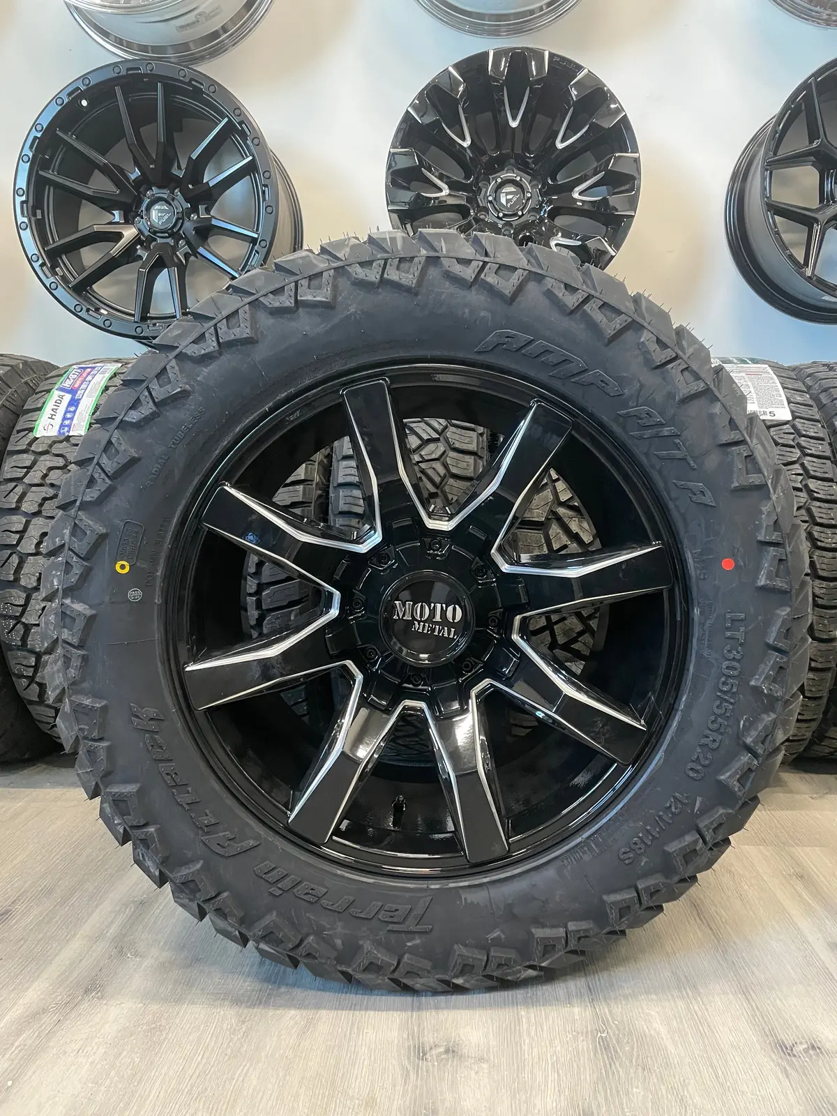 (Set Of Four) Moto Metal Mo804 20X10 8X165.1 -18 Gloss Blk Milled | Lt305/55R20 Amp Attack At 1